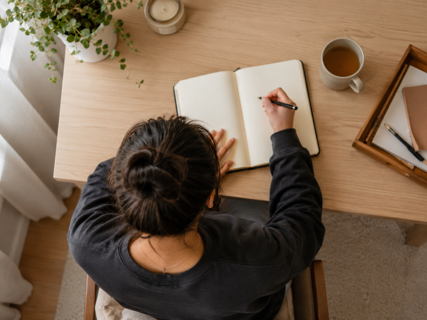 A young person journalling as part of the Bibliotherapy programme